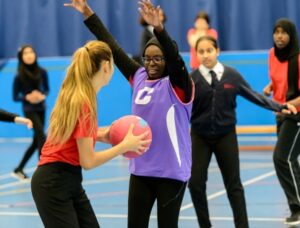 young people play netball