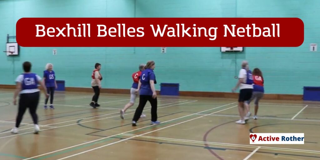 people play walking netball in a sports hall