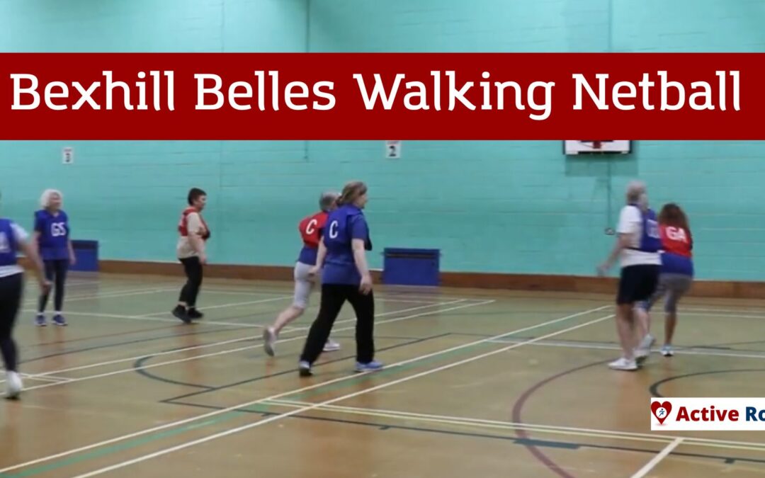 people play walking netball in a sports hall
